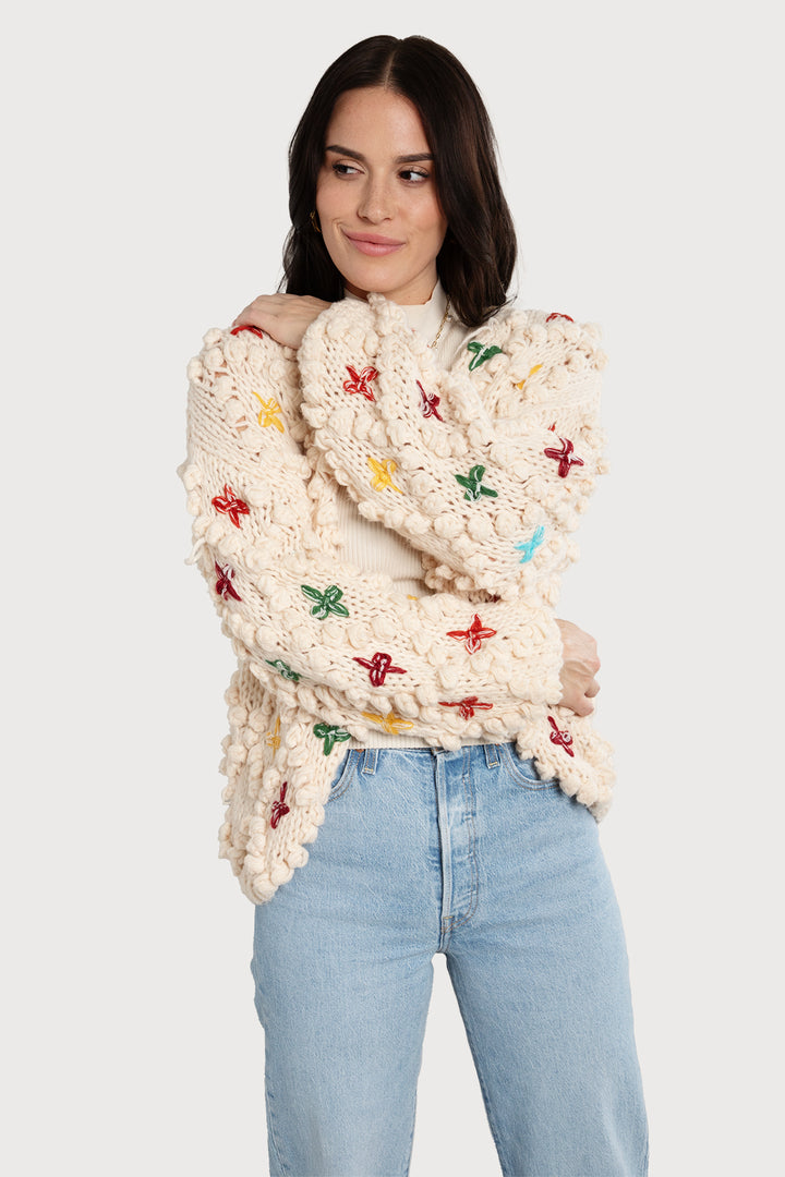 Knitted Cardigan Cross Pom Pom